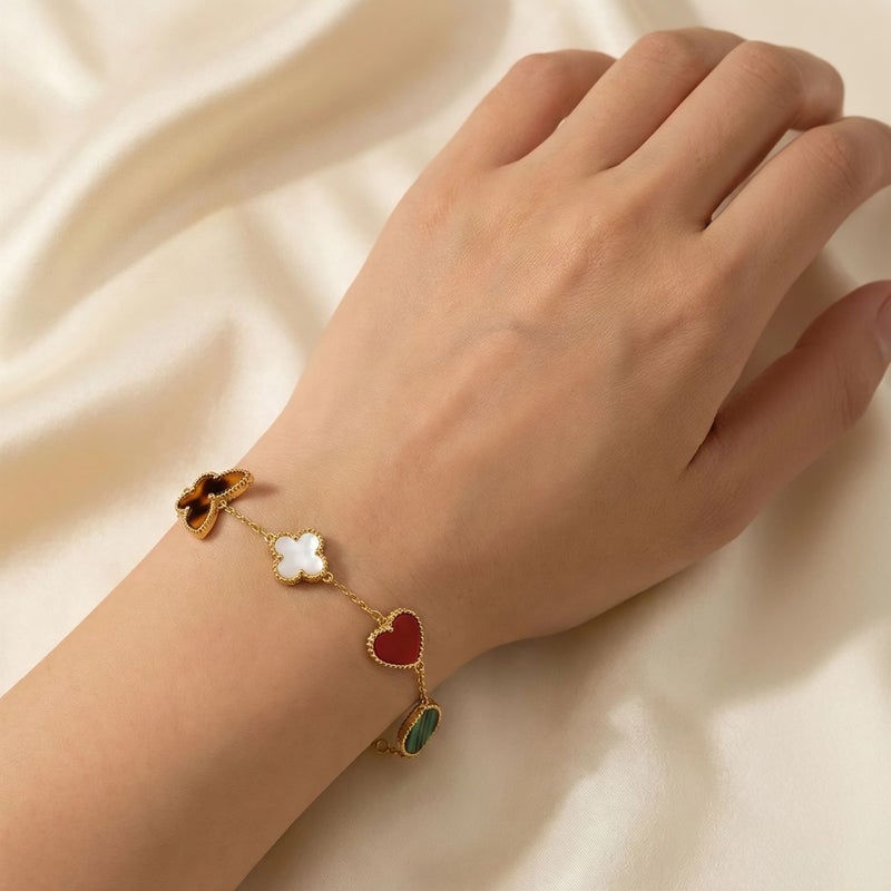 A delicate gold-tone bracelet crafted from rust-resistant stainless steel, adorned with royal green and mother-of-pearl white motifs featuring a butterfly and heart design. It has an adjustable clasp for a perfect fit. - Image 2